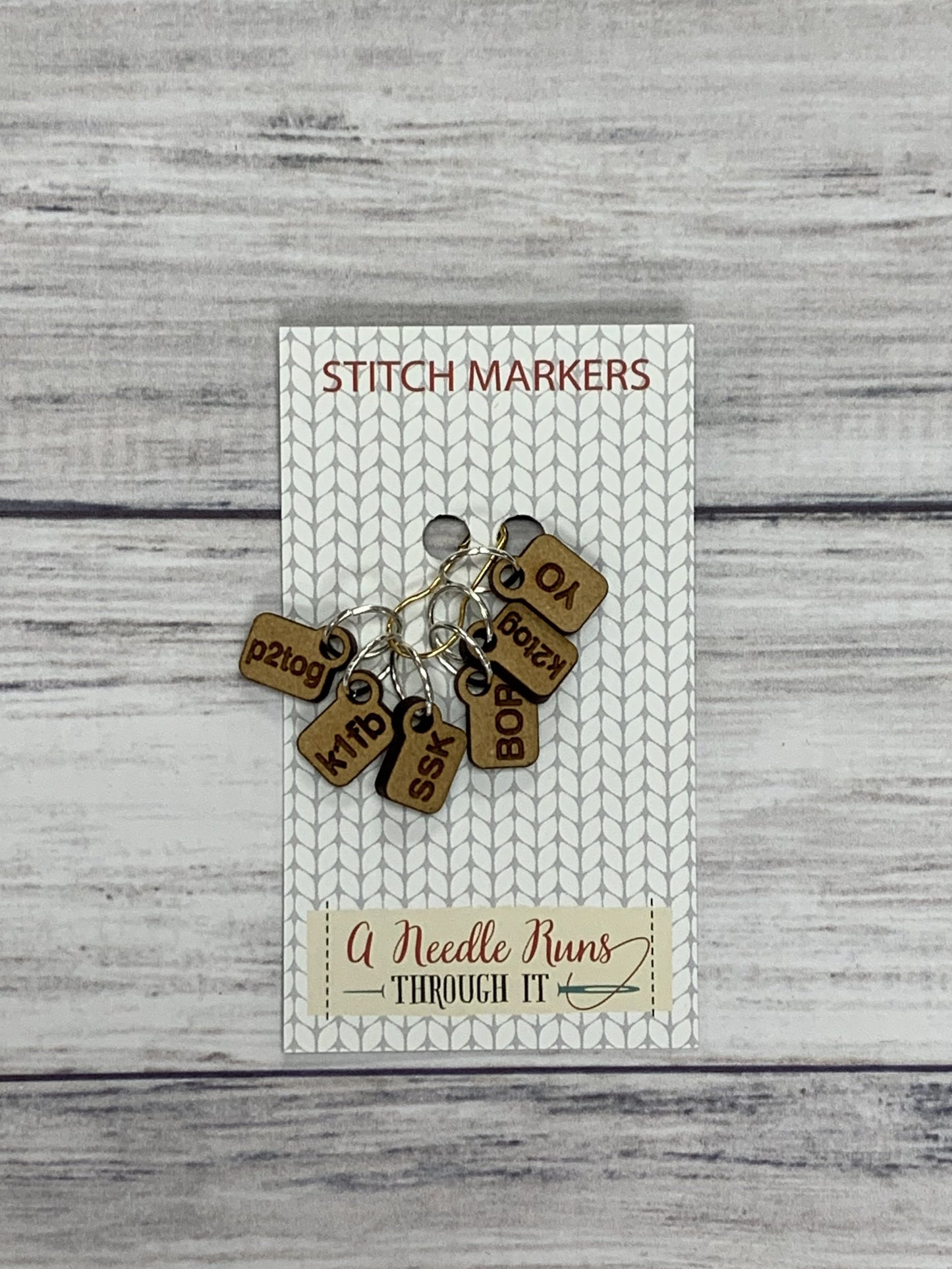 Wooden Ring Stitch Markers by A Needle Runs Though It