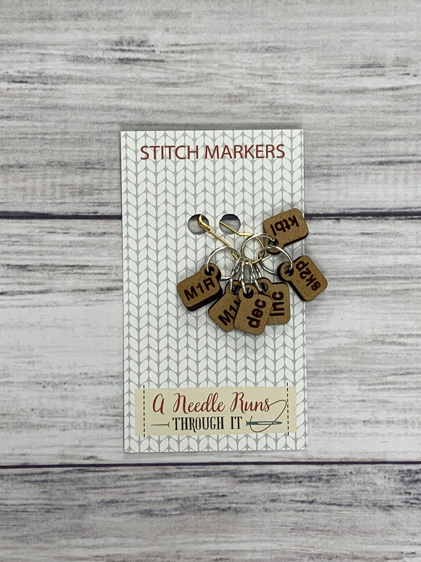 Wooden Ring Stitch Markers by A Needle Runs Though It